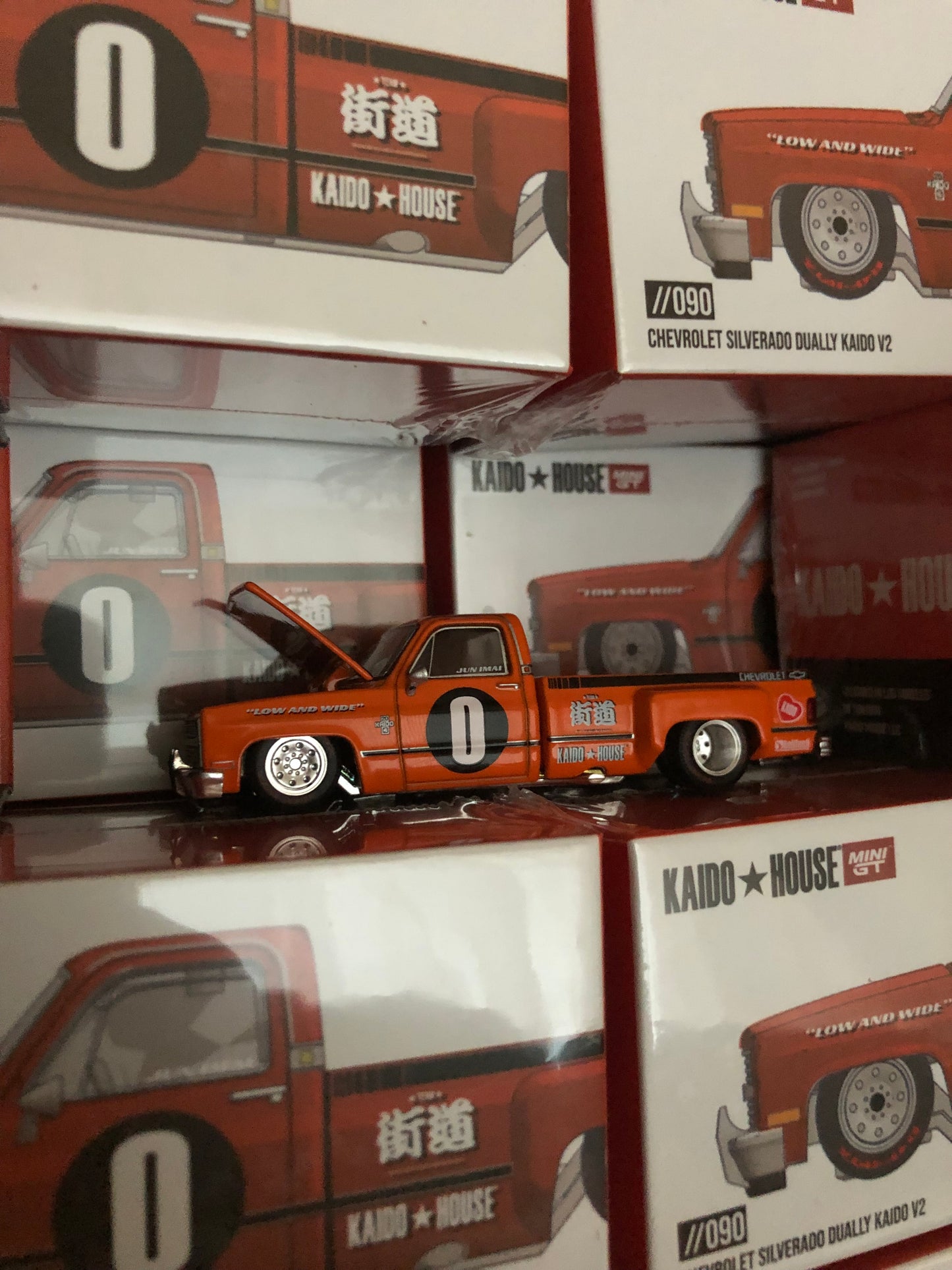 Kaido House x Mini GT 1:64 Chevrolet Silverado Dually KAIDO WORKS V2 – Orange