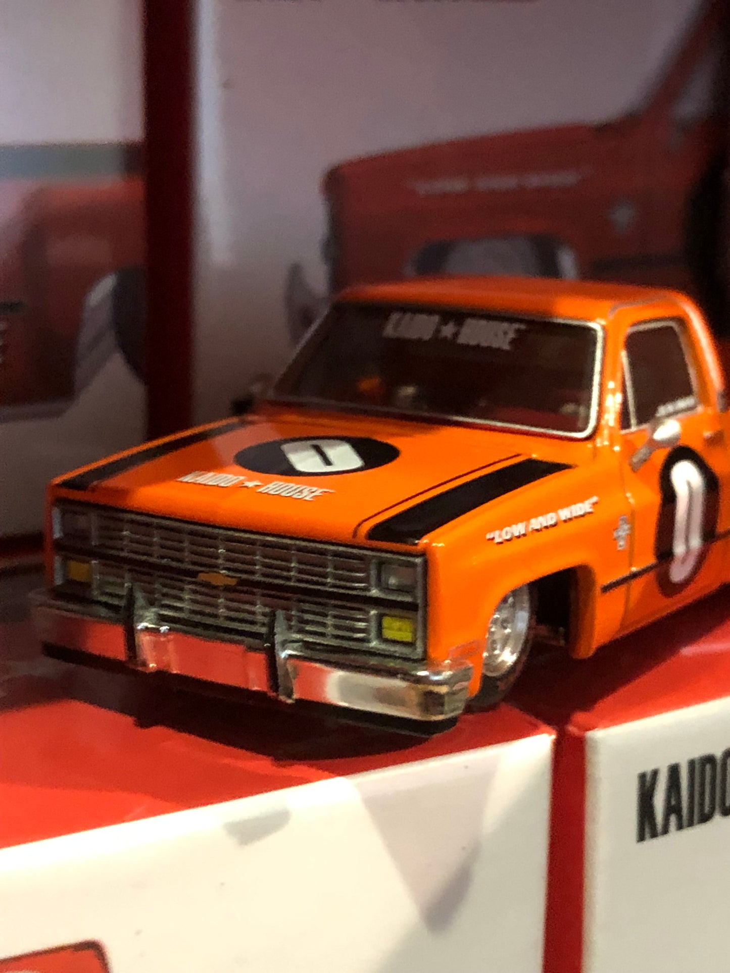 Kaido House x Mini GT 1:64 Chevrolet Silverado Dually KAIDO WORKS V2 – Orange